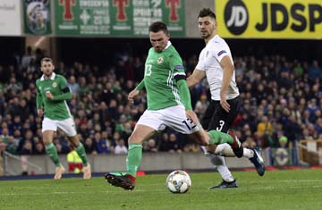 Northern Ireland's Corry Evans (left) goes on to score against Austria during the UEFA Nations League soccer match between Northern Ireland and Austria at Windsor Park in Belfast on Sunday.