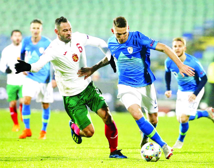 Slovenia's Jaka Bijol (right) challenges Bulgaria's Simeon Slavchev , during the Nations League soccer match between Bulgaria and Slovenia, at Vassil Levski stadium in Sofia on Monday.