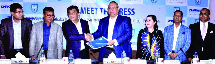 President of Bangladesh Football Federation (BFF) Kazi Md Salahuddin shaking hands with Reshadur Rahman, Chairman of Dhaka Bank Limited after signing an agreement between their respective organizations at the conference room in Bangladesh Football Federat