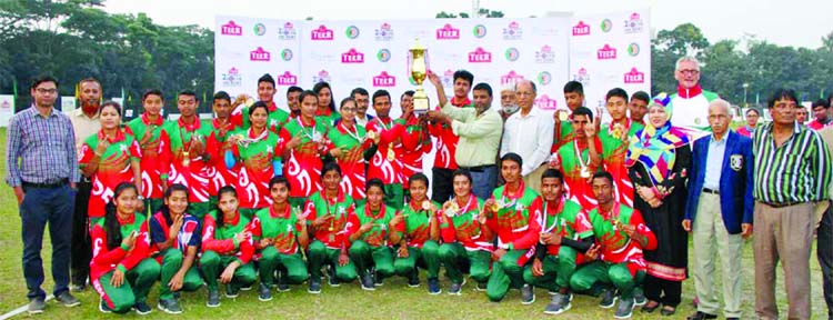 Members of BKSP, the champions of the Teer National Youth (male & female) Archery Championship with the guests and officials of Bangladesh Archery Federation pose for a photo session at Shaheed Ahsan Ullah Master Stadium in Tongi, Gazipur on Tuesday.