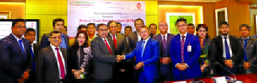 Syed Rafiqul Haq, DMD of Mutual Trust Bank Limited (MTB) and Md. Tanbir Shahid Ratan, Chief Business Officer (Passenger Car Business Unit) of Nitol Motors Limited, exchanging an agreement signing document at the Bank's head office in the city recently. A