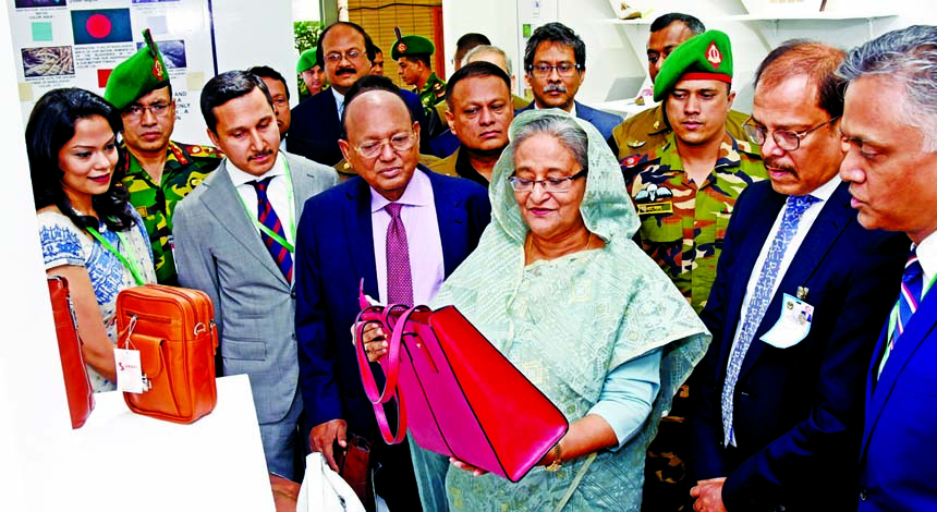 Prime Minister Sheikh Hasina along with Commerce Minister Tofail Ahmed, visiting a stall after inaugurating the 'Bangladesh Leather Footwear and Leather Goods International Sourcing Show 2018', organised by the Leather Goods and Footwear Manufacturers a