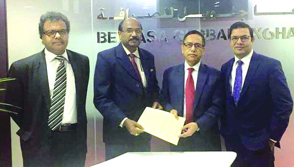 Kazi Towhidul Alam, AMD of Social Islami Bank Ltd (SIBL) and Sajeev Kumar R, General Manager of Belhasa Golabal Exchange (a UAE based global money exchange company), exchanging an agreement signing document to facilitate the inward remittance at the Corpo