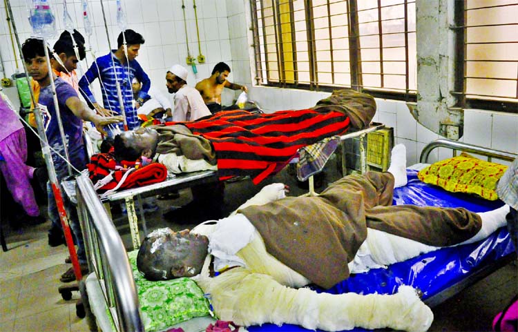 Twelve workers sustained burn injuries following a boiler explosion as melted iron fell on them at a steel and rod factory at Madanpur area of Bandar Upazila in Narayanganj. The photo was taken from DMCH Burn Unit on Friday.