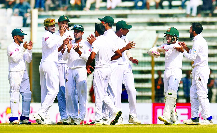 Players of Bangladesh Cricket team celebrate after defeating West Indies on the third day of the first Test between Bangladesh and West Indies at the Zahur Ahmed Chowdhury Stadium in Chattogram on Saturday.