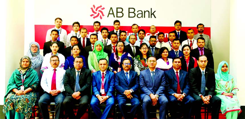 Sajjad Hussain, Managing Director (CC) of AB Bank Limited, poses for a photograph with the participants of a training program on "Anti-Money Laundering & Combating Financing of Terrorism" for its officials at the Bank's training institute in the city r