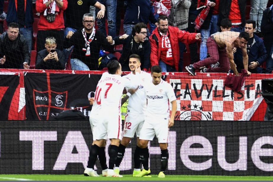 Sevilla's Portuguese forward Andre Silva (centre) celebrates after scoring during the Spanish league football match Sevilla FC against Real Valladolid FC at the Ramon Sanchez Pizjuan stadium in Sevilla on Sunday.