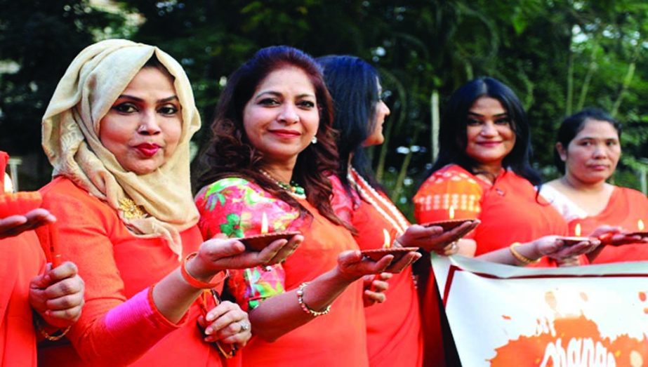 Members of the Zonta Club of Greater Dhaka initiated a 16-day programme to eliminate violence against women by lighting lamps on Sunday marking International Day for the Elimination of Violence Against Women. UNB photo