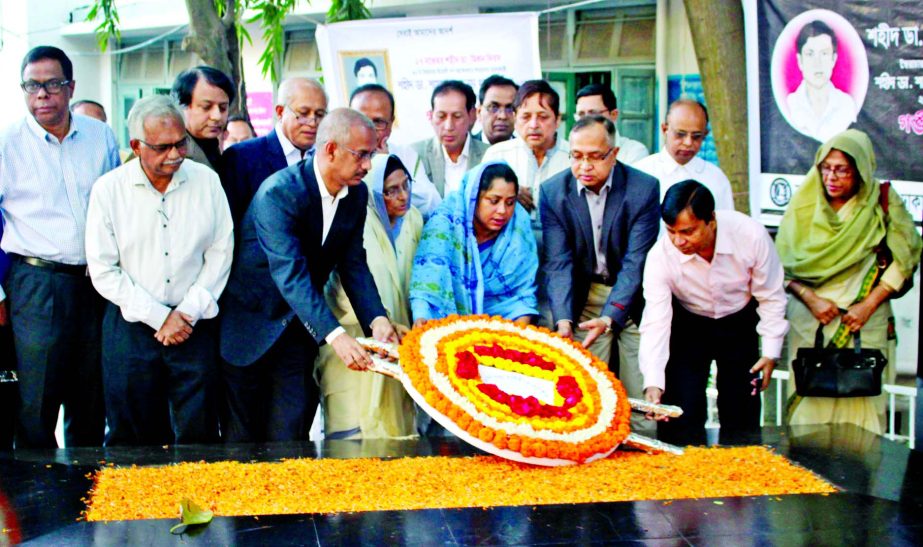 Marking the 28th Martyrdom anniversary of Dr Shamsul Alam Khan Milon, family members placing floral wreaths at his Mazar on the Dhaka Medical College Hospital premises on Tuesday.