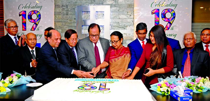 A Rouf Chowdhury, Chairman of Bank Asia Limited, inaugurating its 19th anniversary celebration programme by cutting a cake at the Bank's corporate office in the city on Tuesday. Md. Arfan Ali, Managing Director, Mohd. Safwan Choudhury, Md. Nazrul Huda, V