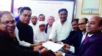 KALKINI (Madaripur ): Dr Abdus Sobhan Golap, Office-Secretary , Bangladesh Awami League submitting nomination paper for Madaripur-3 Constituency to Assistant Returning Officer and Kalkini UNO Md Aminul Islam at his office yesterday.