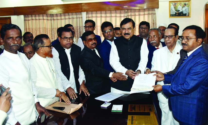 MADARIPUR: Md Wahidul Islam , Returning officer of Madaripur receiving nomination paper from Shipping Minister Md Shahjahan Khan for Madaripur -2 seat yesterday. Among others, Syed Abul Basar, Senior Vice - President, Madaripur District Awami League wa