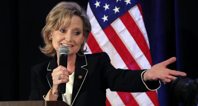 Republican US Sen. Cindy Hyde-Smith calls on her family members to identify themselves as she celebrates her runoff win over Democrat Mike Espy in Jackson, Miss., on Tuesday..