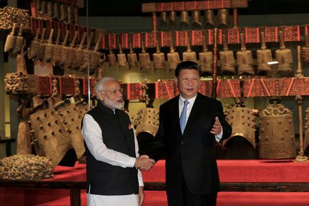 Chinese President Xi Jinping and Indian Prime Minister Narendra Modi shake hands as they visit the Hubei Provincial Museum in Wuhan, Hubei province, China. AP file photo
