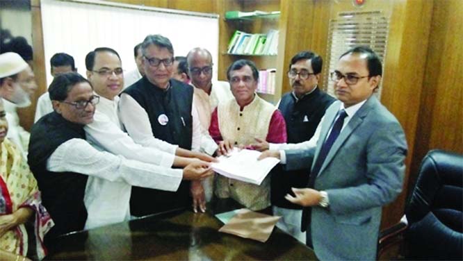 MOULVIBAZAR: Md Tofayel Islam, DC receiving nomination paper from BNP nominated candidate M Naser Rahman for Moulvibazar-3 seat recently.