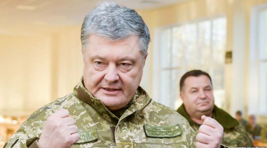Ukrainian President Petro Poroshenko speak to soldiers during a visit to a military base in Chernihiv region.