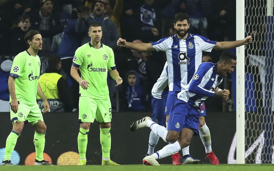 Porto defender Eder Militao (right) celebrates after scoring the opening goal during the Champions League group D soccer match between FC Porto and FC Schalke 04 at the Dragao stadium in Porto, Portugal on Wednesday.