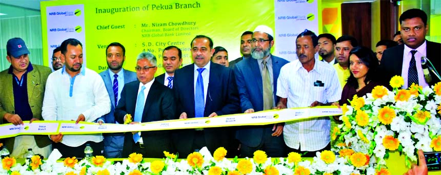 Nizam Chowdhury, Chairman of NRB Global Bank Limited, inaugurating its new branch at Pekua in Cox's Bazar on Thursday. Syed Habib Hasnat, Managing Director, senior officials of the Bank and local elites were also present.