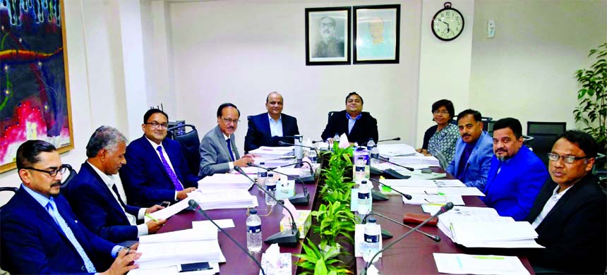 Chowdhury Nafiz Sharafat, Chairman, Board of Directors of Farmers Bank Limited, presiding over its 42nd meeting at the Bank's head office in the city recently. Mohammad Ehsan Khasru, CEO, Dr. Hasan Taher Imam, Vice-Chairman, Md. Obayed Ullah Al Masud, CE