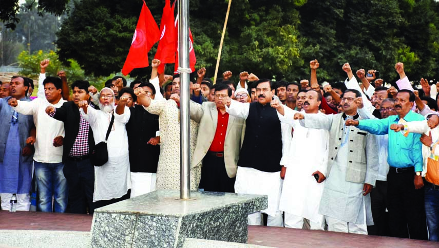 Shipping Minister and also Convenor of Sammilita Muktijoddha Sangsad Shajahan Khan along with other freedom fighters taking oath at 'Shikha Chirantan' in the city's Suhrawardy Udyan on Saturday with a call to declare December 1 as 'Muktijoddha Dibash"