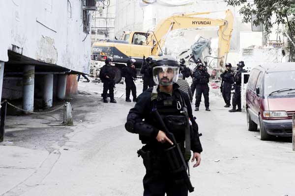 Israeli authorities destroy shops in the refugee camp of Shuafat in Jerusalem. President Donald Trump's recognition of Jerusalem has set off an increasingly visible battle in the city's eastern sector _ with an emboldened