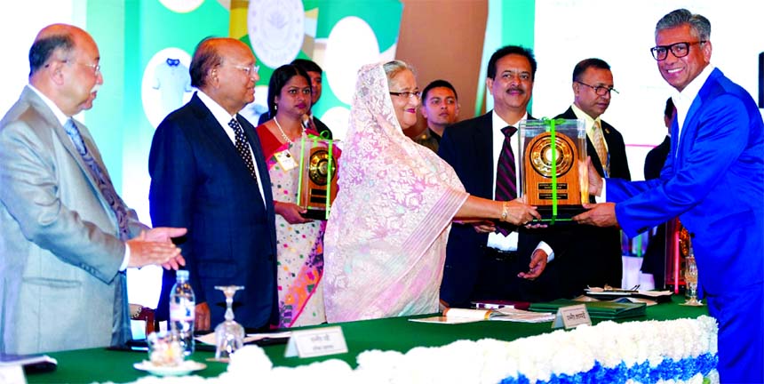 Shakhawat Hossain, Managing Director of Paramount Textile Limited, receiving the National Export Trophy for the year 2015-2016 from Prime Minister Sheikh Hasina, jointly organized by Export Promotion Bureau and Commerce Ministry at Pan Pacific Sonargaon H