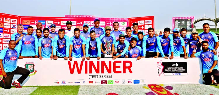 Members of Bangladesh Cricket team pose for photo session after beating West Indies in the second and final Test at the Sher-e-Bangla National Cricket Stadium in the city's Mirpur on Sunday. The Tigers whitewashed the Caribbeans 2-0.