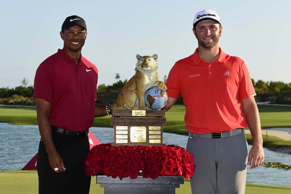 Spain's golfer Jon Rahm (right) poses with U.S. golfer Tiger Woods after Rahm won the Hero World Challenge at Albany Golf Club in Nassau, Bahamas on Sunday.
