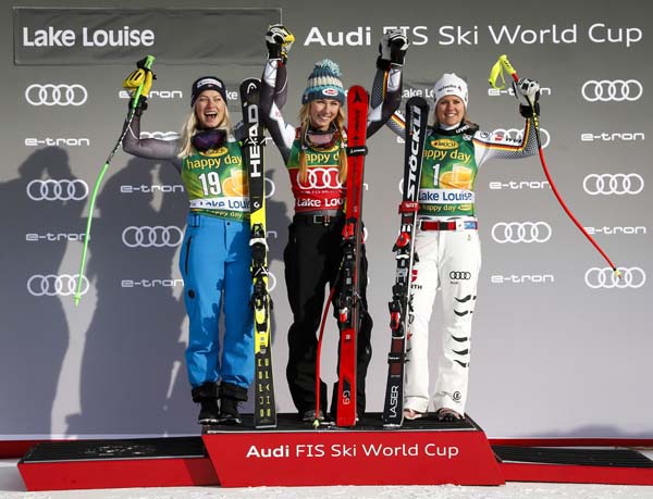 Mikaela Shiffrin (center) of the United States, celebrates her victory with second-place finisher Norway's Ragnhild Mowinckel (left) and third-place finisher Germany's Viktoria Rebensburg following the women's World Cup super G ski race in Lake Louise,