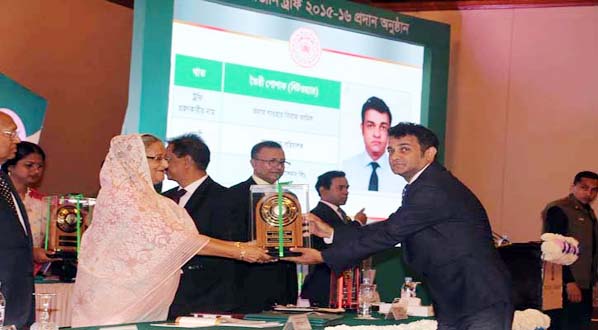 Managing Director of 4H Group and Vice President of BKMEA Gowhar Siraj Jamil receiving the Export Trophy (Bronze)for the year 2015-16 for his outstanding contributions on export business of the Country from the Prime Minister Sheikh Hasina at Pan Paci