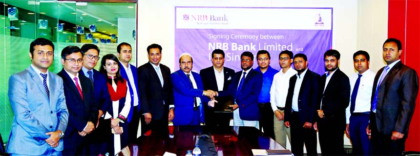 Saaduddin Ahmed, DMD of NRB Bank Limited and ANM Tajul Islam, Head of Marketing of Ibn Sina Trust, exchanging an agreement signing document for employees and customers of the Bank to provide medical facilities at discounted rates at the Bank's head offic