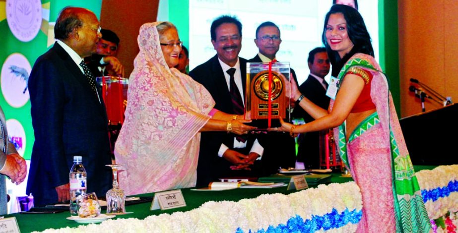 Amrita Makin Islam, DMD of Picard Bangladesh Limited, receiving The National Export Trophy from Prime Minister Sheikh Hasina for highest export in Leather goods for the Fiscal Year 2015-2016 at Pan Pacific Sonargaon Hotel in the city on Sunday.