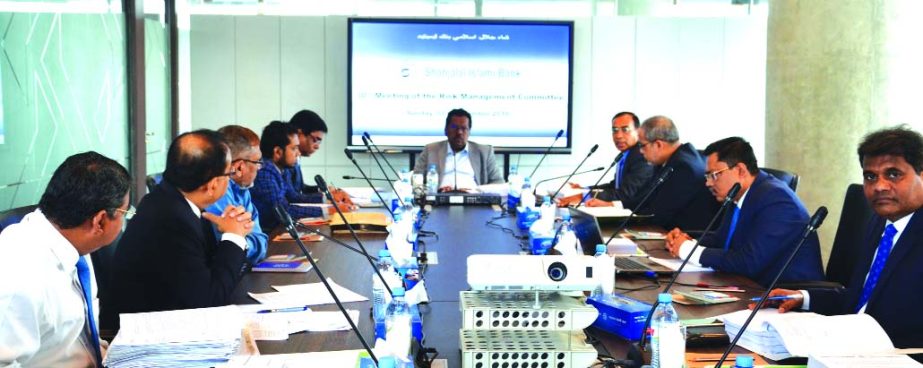 Mohammad Younus, Chairman of Risk Management Committee (RMC) and Director of Shahjalal Islami Bank Limited, presiding over its 30th RMC meeting at its head office in the city recently. M Shahidul Islam, Managing Director of the Bank and Md. Moshiur Rahman