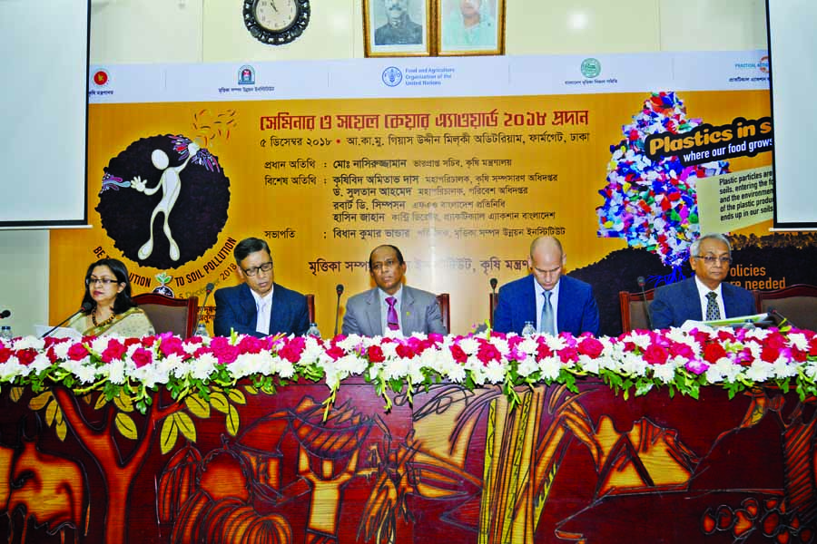 Acting Secretary of the Agriculture Ministry Md. Nasiruzzaman along with other distinguished persons at a seminar in Gias Uddin Milky Auditorium in the city on Wednesday in observance of World Soil Day.