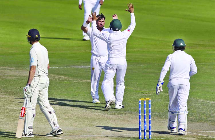 Pakistan's Yasir Shah celebrates dismissal of New Zealand's Will Sumerville in their Test match in Abu Dhabi, United Arab Emirates on Thursday.