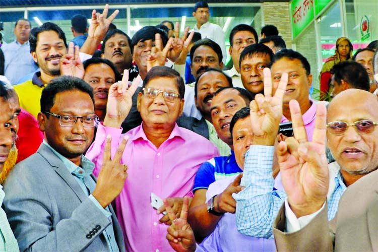 Candidates rejoicing with V-sign as their nominations were declared valid after appeal hearing on Thursday. This photo was taken from in front of EC office.