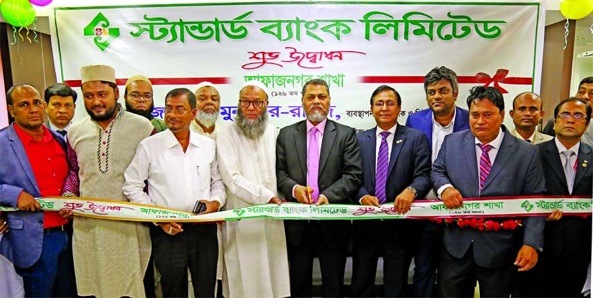 Mamun-Ur-Rashid, Managing Director of Standard Bank Limited, inaugurating its 126th branch at Afaznagar Residential Area in Fatullah in Narayanganj on Thursday. Md. Tariqul Azam, AMD, Syed Monsoor Ali, Vice-President and other senior officials of the Bank