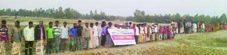 GANGACHARA(Rangpur): People at Motukpur and Chilakhal Char area formed a human chain protesting establishment of solar power plant on cultivable land on Wednesday.