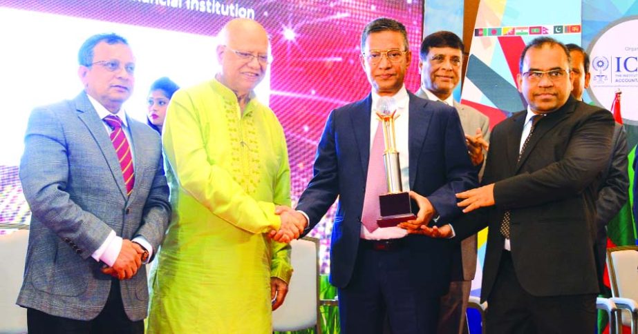 Md. Abdus Salam Azad, Managing Director of Janata Bank Limited, receiving the 'Best Corporate Award-2017' from Finance Minister Abul Maal Abdul Muhith, by the Institute of Cost and Management Accountants of Bangladesh (ICMAB) under State Owned Commercia