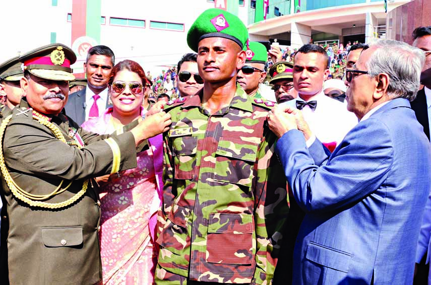 President Abdul Hamid adorning rank badges to the newly commissioned officers of the 76th army long course at Bangladesh Military Academy (BMA) parade ground at Bhatiari in Chattogram on Saturday. ISPR photo