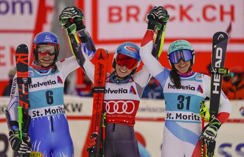 United States' Mikaela Shiffrin (center) winner of a women's World Cup parallel slalom, poses with second placed Slovakia's Petra Vlhova (left) and third placed Switzerland's Wendy Holdener in St. Moritz, Switzerland on Sunday.