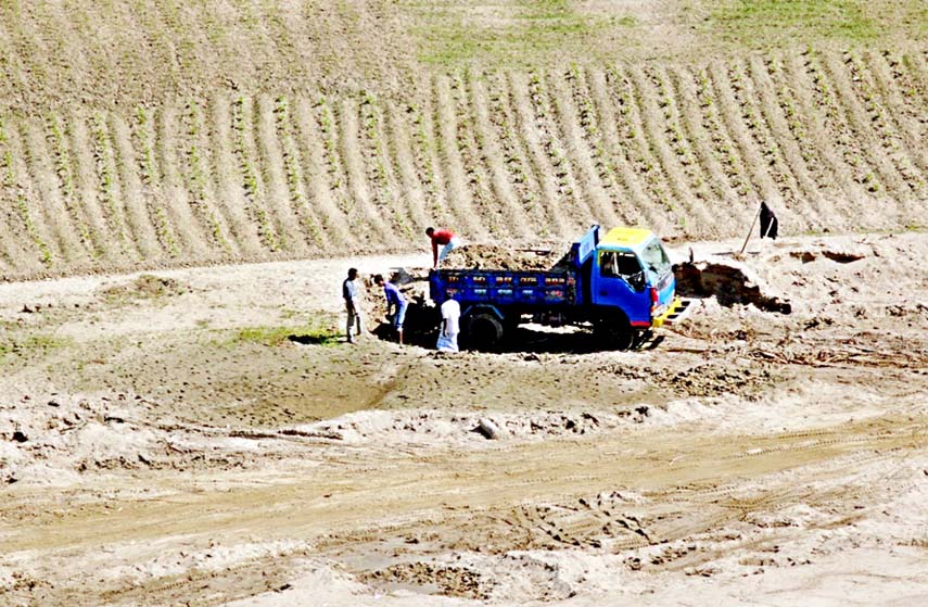 Illegal hill cutting going on beside Sangu River in Bandarban. This snap was taken on Sunday.