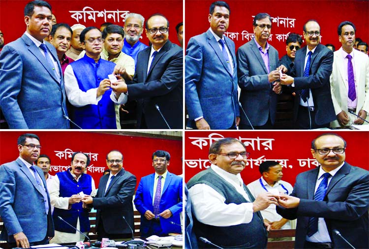 Election symbols were distributed among the parties at Divisional Commissioner office in city's Segunbagicha on Monday for upcoming polls on December 30.