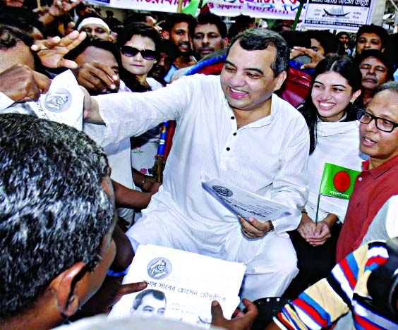 AL candidate Saber Hossain Chowdhury conducting polls campaign in city's Khilgaon area on Tuesday.