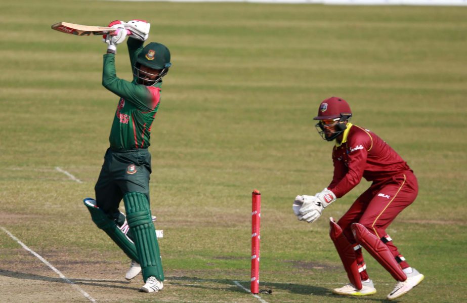 Opener Tamim Iqbal (left) of Bangladesh plays a shot during the second One Day International match between Bangladesh and West Indies at the Sher-e-Bangla National Cricket Stadium in the city's Mirpur on Tuesday.
