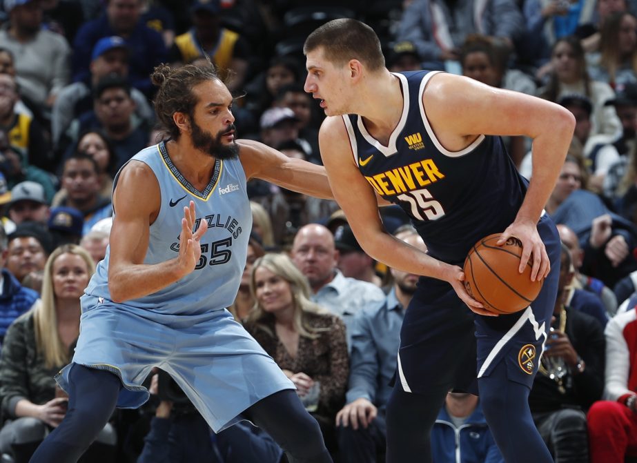 Utah Jazz guard Donovan Mitchell (45) tries to get past Oklahoma City Thunder center Steven Adams (12) in the second half of an NBA basketball game in Oklahoma City on Monday.