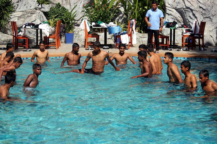 Members of Bangladesh Under-15 Football team passing their time at a swimming pool in Thailand on Tuesday.