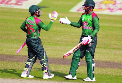 Tamim Iqbal (right) celebrating with his teammate Mushfiqur Rahim after scoring a boundary during the second One Day International (ODI) match against West Indies at the Sher-e-Bangla National Cricket Stadium in the city's Mirpur on Tuesday.