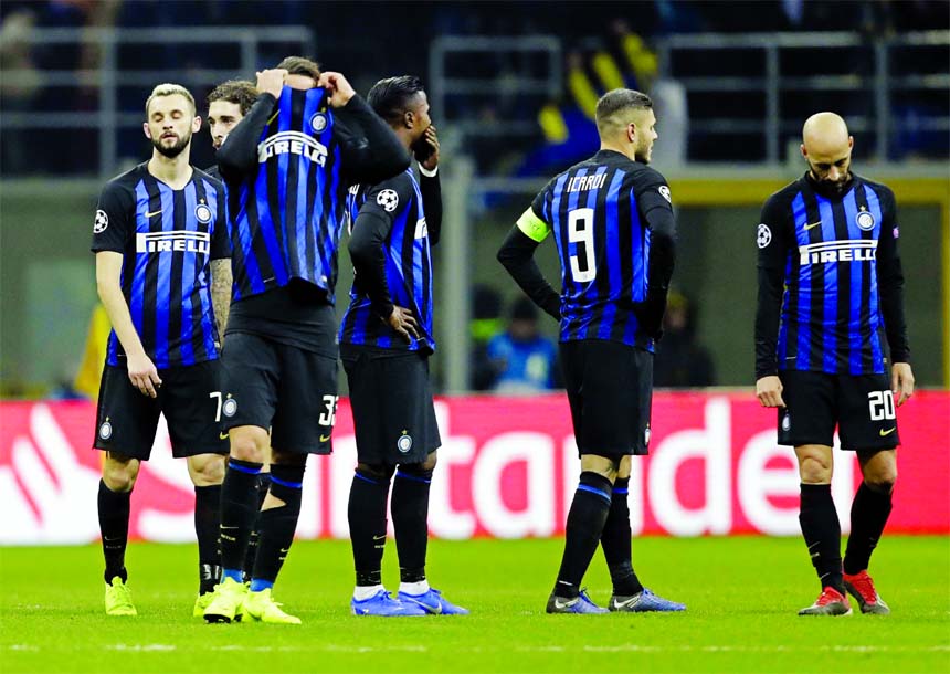 Inter Milan's players react at the end of the Champions League, Group B soccer match between Inter Milan and PSV Eindhoven, at the San Siro stadium in Milan, Italy on Tuesday.