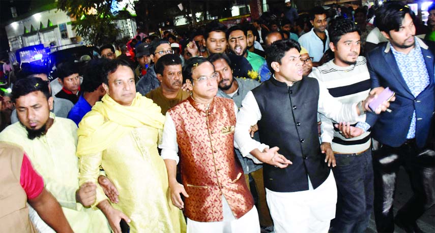 Hazi Mohammad Selim, a candidate of the 11th parliamentary elections along with others including ward councilor Hashibur Rahman Manik at an electioneering campaign in favour of 'Boat' for Dhaka-7 constituency in the city's Azimpur area on Wednesday.